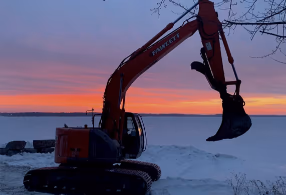 Excavator silhouette at sunset
