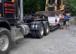 Loading equipment onto truck